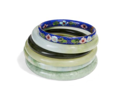 A group of Chinese jade and green hardstone bangles and a cloisonné-enamel bangle Late Qing dynasty-20th centuryComprising: t