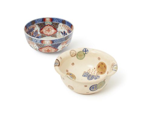 A Japanese Satsuma bowl and an Imari bowlMeiji period, 19th centuryThe Satsuma bowl decorated with floral medallions,18.5cm d