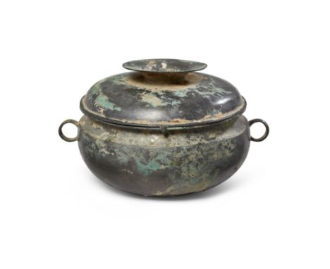 A Chinese archaic bronze ritual food vessel and cover, guiHan dynastyThe globular body with a pair of circular loop handles, 