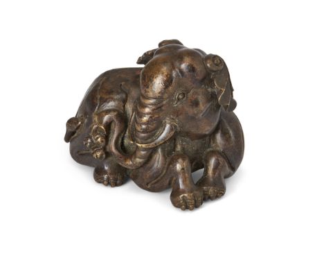 A large Chinese bronze 'elephant' scroll weightRepublic periodThe recumbent beast well-modelled, patinated to a dark, rich hu