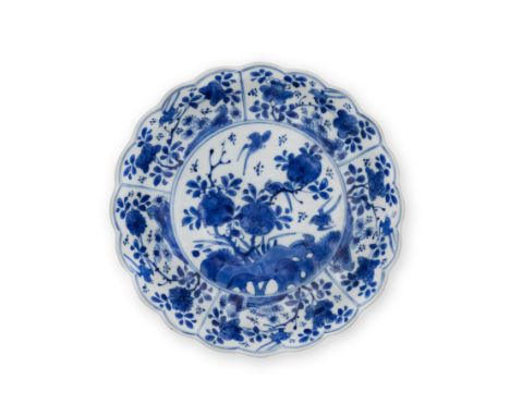 A Chinese blue and white 'birds and flowers' foliate-rimmed dishQing dynasty, Kangxi period, Ji mark Painted to the centre an