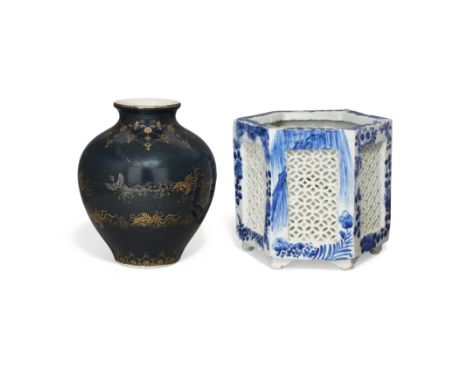 A Japanese Kutani gilt decorated vase and a blue and white jardinièreMeiji periodThe vase overall applied with dark blue glaz