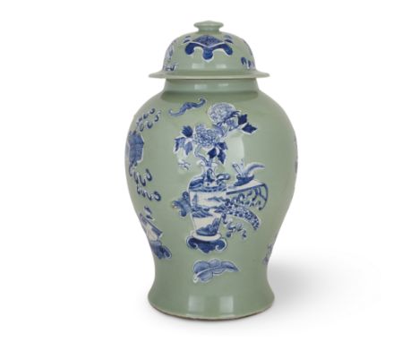 A large Chinese celadon-ground blue and white moulded baluster jar and cover20th century With moulded blue and white bats and