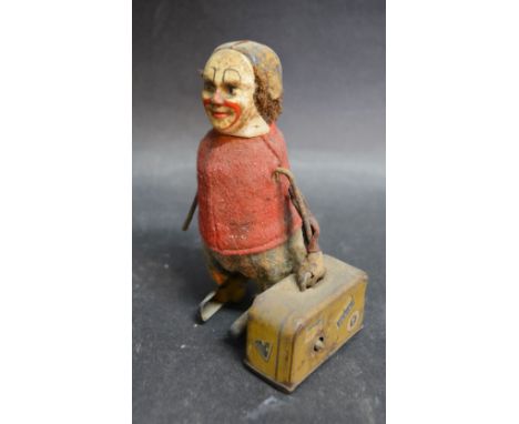 An Early 20th Century Schuco Automaton in the form of a Figure with a Suitcase, 11 cms tall