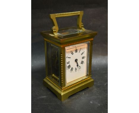 A 19th Century French Brass Cased Carriage Clock, the enamel dial with Roman numerals and with lever escapement and carrying 