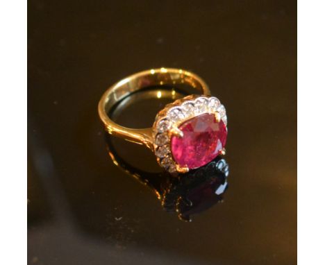 An 18ct. Yellow Gold Treated Ruby and Diamond Cluster Ring, 3.78 / 0.41 ct.