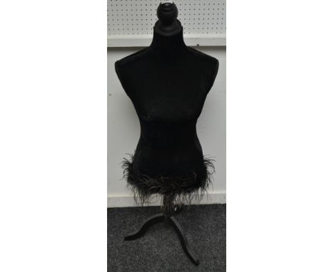 A mannequin torso display stand