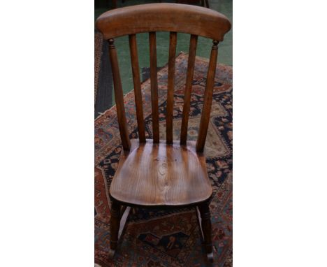 A Victorian beech comb-back kitchen rocking chair, c.1880