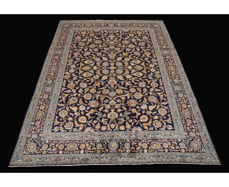 A Kashan carpet, the cerulean ground bordered by a light blue ground with flowers and foliage in tones of ecru and mustard, 4