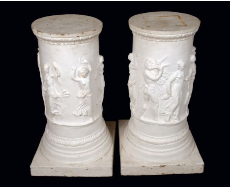 A pair of substantial Neo-Classical design statuary pillars, each in bas relief with bands of revelling classical figures, sq