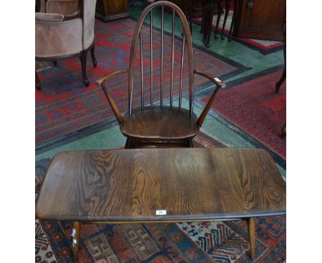 An Ercol coffee table; an Ercol hooped back rocking chair (2)