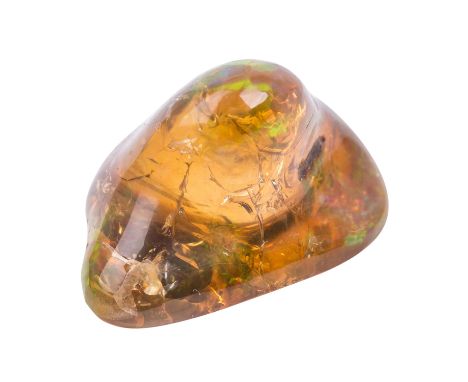 Äthiopischer Welo Opal, 69 Karat, unregelmässig geformt bzw. poliert. Bernsteinfarben mit Farbspiel des Regensbogens. Einschl
