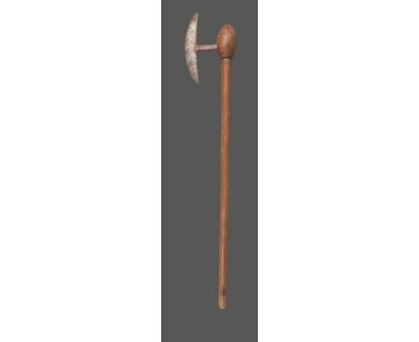 A Zulu axe South Africa with a crescent shape metal blade and a shaft with an ovoid head, 86cm long.