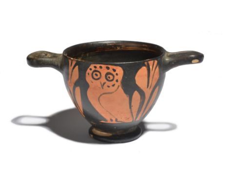 A Greek red-figure owl skyphos South Italian, circa 4th Century BC decorated with an owl and laurel sprigs each side, 6cm hig