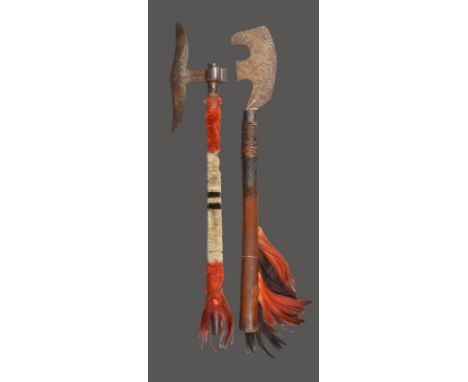 A Naga knife dao Nagaland with a notched curved iron blade and a fibre bound wood handle with dyed and natural horse hair, 66