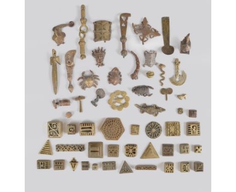 A collection of Ashanti goldweights Ghana brass, including thirty-one geometric, twelve animals, a mask, two swords, a hammer