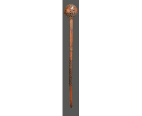 A Zulu knobkerrie South Africa with brass studded spherical head and remains of two-tone wire to the shaft, 69cm long.