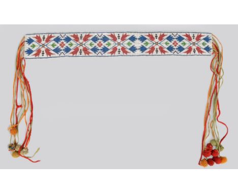 A Chippewa sash Northeast, North America coloured glass bead foliate panel with coloured wool tassels, 184cm long, 11.5cm wid