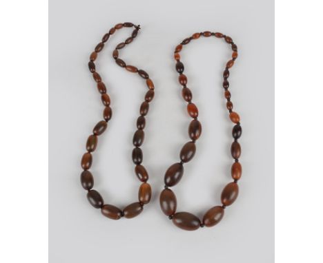 Two horn bead necklaces graduated, one with ovals and with black horn spacers, 38cm long, the other with oblongs and a button