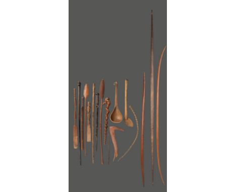 A large Zulu spoon South Africa with carved and burnished decoration to the back of the bowl, the handle inscribed an R, 61cm