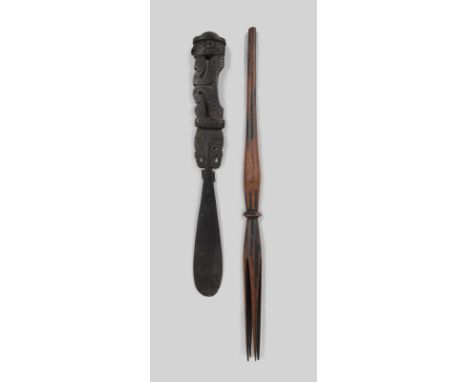 A Massim lime spatula Trobriand Islands, Papua New Guinea with a carved and pierced seated figure, 25.5cm long, and a Fiji ca