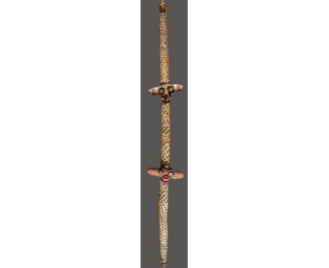 A Vanuatu ceremonial bow Melanesia fibre banding with two fibre and pigment masks, 140cm long. Provenance Todd Barlin, Sydney