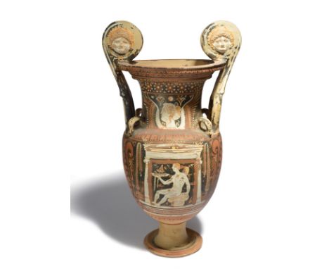 An Apulian red-figure volute krater circa 4th century BC painted with a white ionic naiskos with a seated naked male figure h