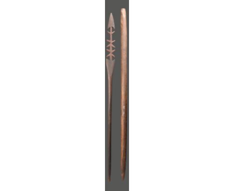 An Aboriginal ceremonial spear Western Australia 122cm long, and an Aboriginal fighting stick, the grip with scored decoratio