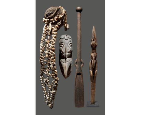 A Sepik finial Papua New Guinea carved an ancestor figure and bird head, 46.5cm high, on a stand, a Sepik mask, 29.5cm high, 