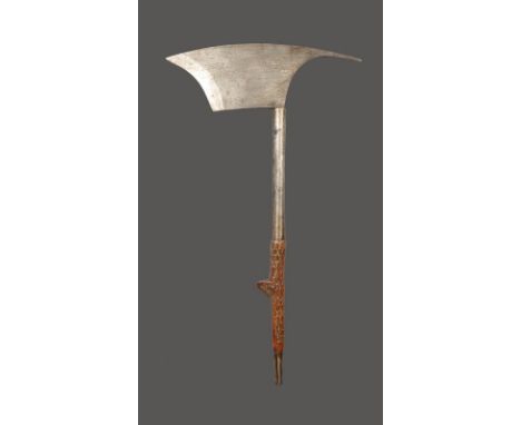 A Bontoc axe Philippines with a steel blade and wood spurred grip inlaid with brass, 55.5cm long.