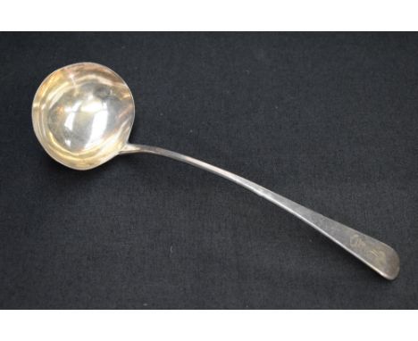 A George III silver Old English pattern ladle, the terminal engraved with lion and banner crest under the initials JC, marks 