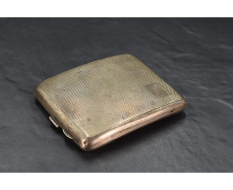 A George VI silver cigarette case, of hinged rectangular form curved for the gentleman's pocket and engine-turned throughout,