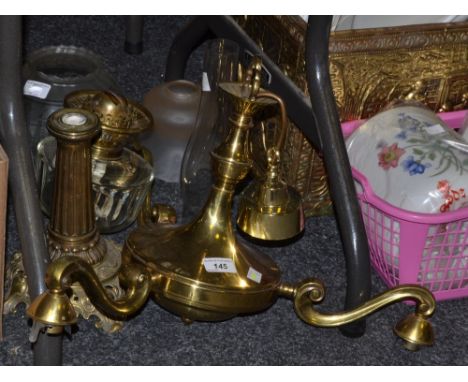 Lighting - a Victorian oil lamp, clear glass reservoir (faults);  a brass three branch ceiling light (2)