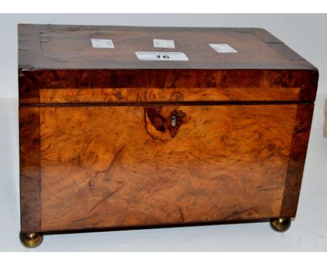 A George III  burr walnut tea caddy, the interior with two lidded compartments, brass ball feet, c.1810
