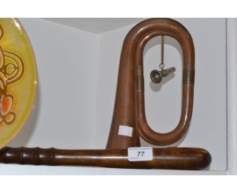 A brass and copper bugle;  a hardwood Truncheon, initialled with crown and L.C.C.