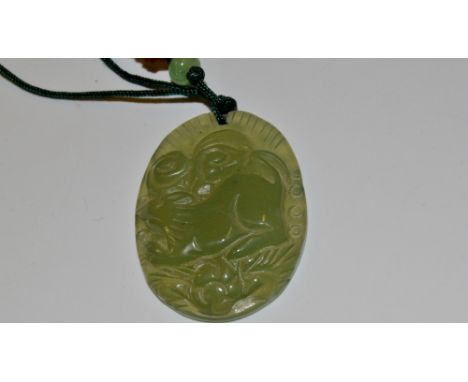 A contemporary carved jade pendant necklace , carved with a rodent 