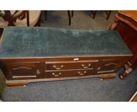 An early 20th century  mahogany storage cabinet/bench, bracket feet, upholstered in azure (conversion)
