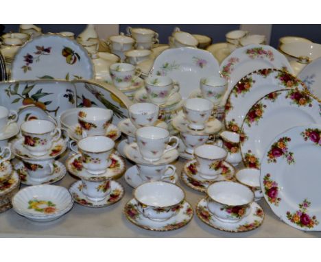 A Royal Worcester Evesham pattern flan dish; other Evesham; a pair of Royal Albert Old Country Roses dinner plates; other Old