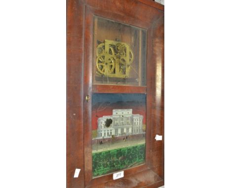 An American mahogany wall clock, coiled movement, striking on a gong, painted glass panel, New Opera House, New Orleans
