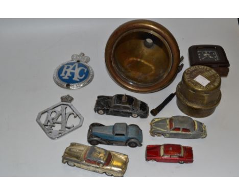 Automobelia - a vintage Ford brown bakelite dashboard clock;  a Hardman brass radiator cap;  a brass carriage head lamp;  two
