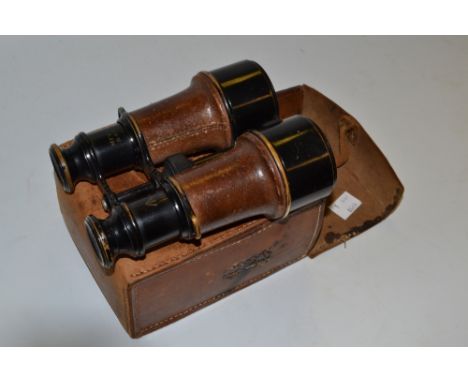 A pair of World War I military binoculars, by Lacombe, Paris, arrow mark, inscribed MkV SPL 64519, leather grips and case, c.