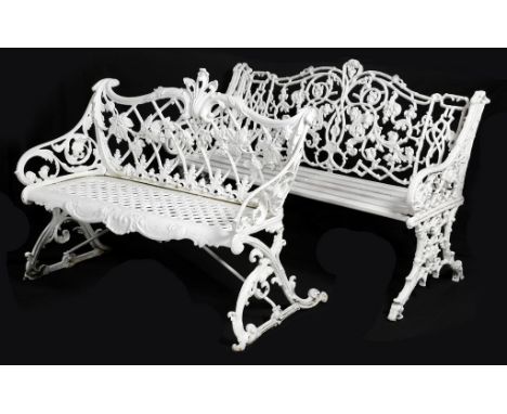 A white painted cast iron bench in Coalbrookdale style, decorated with a grape vine and leaf scrolls, 86cm high, 106cm wide, 
