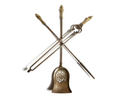 A set of three Victorian steel fire tools, each with a foliate gilt brass handle, with a pierced pan, 76.5cm long (max). (3)