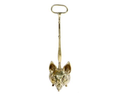 Hunting interest. A brass fox's head doorstop, with a ring handle and a turned stem, above a lead weighted base, 46.5cm high.