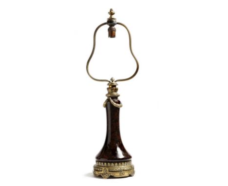 A late 19th century French ormolu and serpentine table lamp, decorated in the Louis XV style with laurel swags and florets, t