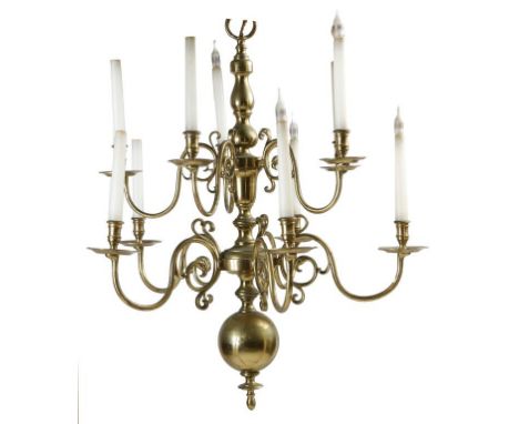 An early 18th century style Dutch gilt brass ten light chandelier, the baluster turned stem with a ball pendant issuing ten s