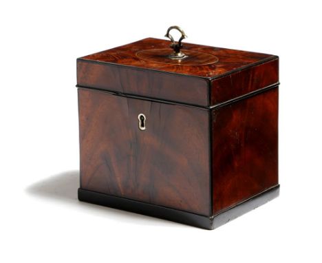 A late George III mahogany tea caddy, with ebonised stringing and edging, the hinged top with an oval inlaid panel and a bras