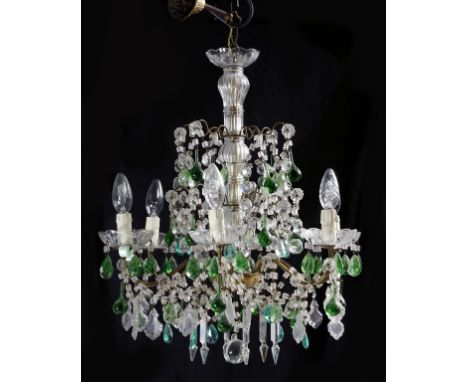 A continental glass and gilt metal six light chandelier, with a ribbed central stem and hung with green and clear glass penda