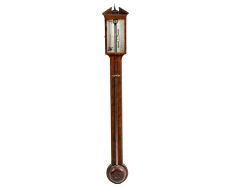 A George III mahogany stick barometer, with an architectural pediment centred with a turned brass urn finial, above a silvere