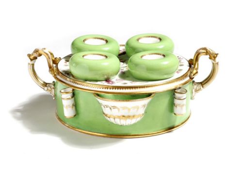 A large early 19th century porcelain inkstand, painted in apple green and gilt, finely decorated with floral sprays and entwi